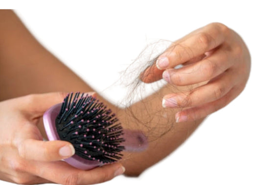 Pulling hair out of a brush - hair falling out. 